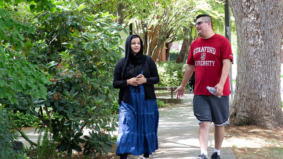 two EOPS students walking together on campus