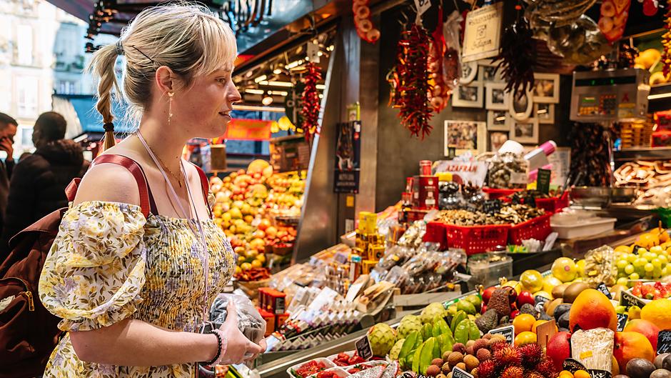 woman looking at colorful food in Barcelona Spain
